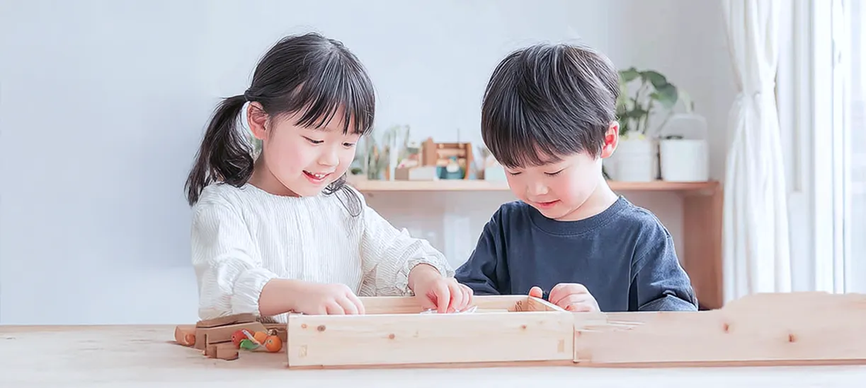 Children playing with wooden toys